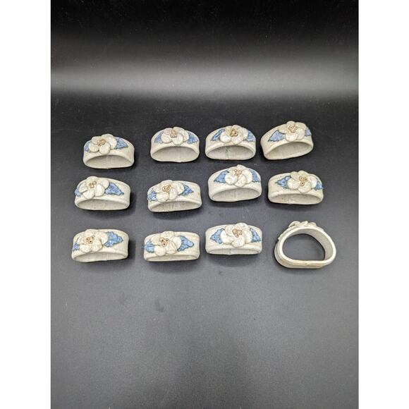 Set of 12 Handmade Pottery Napkin Ring Flowers white and blue approx 2 inches - Picture 1 of 9
